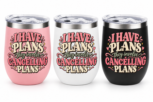 Three insulated stemless tumblers with clear lids are shown side by side on a white background. The tumblers are pink, white, and black, each featuring the printed phrase 'I HAVE PLANS they involve CANCELLING PLANS' in pink, cream, and dark lettering.