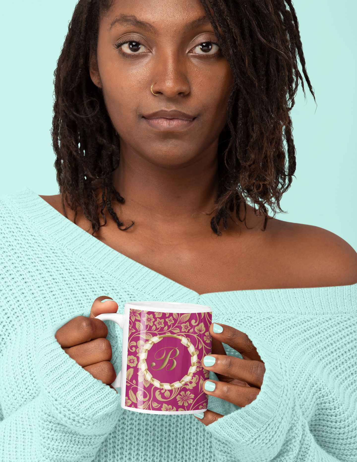 Pretty black female holding a customised pink and gold initial mug
