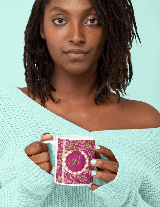 Pretty black female holding a customised pink and gold initial mug