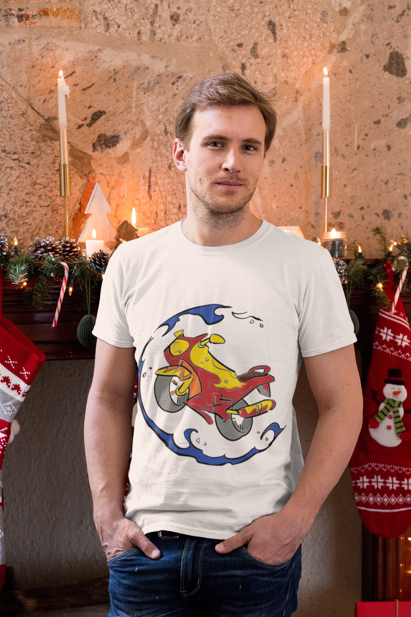 Man posing in front of christmas decorations in a white t-shirt
