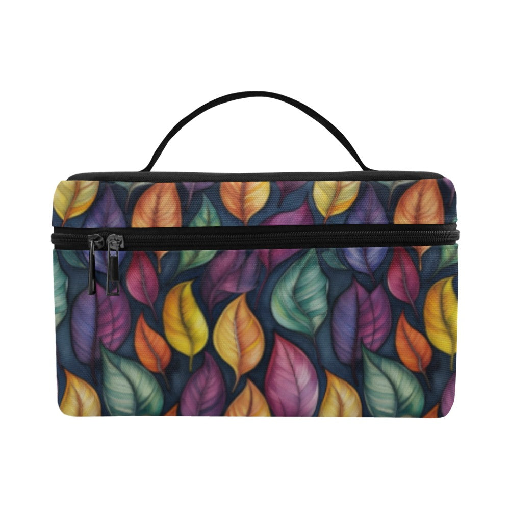 A rectangular zippered cosmetic bag with a colorful leaf pattern in purple, orange, yellow, green, and blue on a dark background, featuring a black top handle and zipper.
