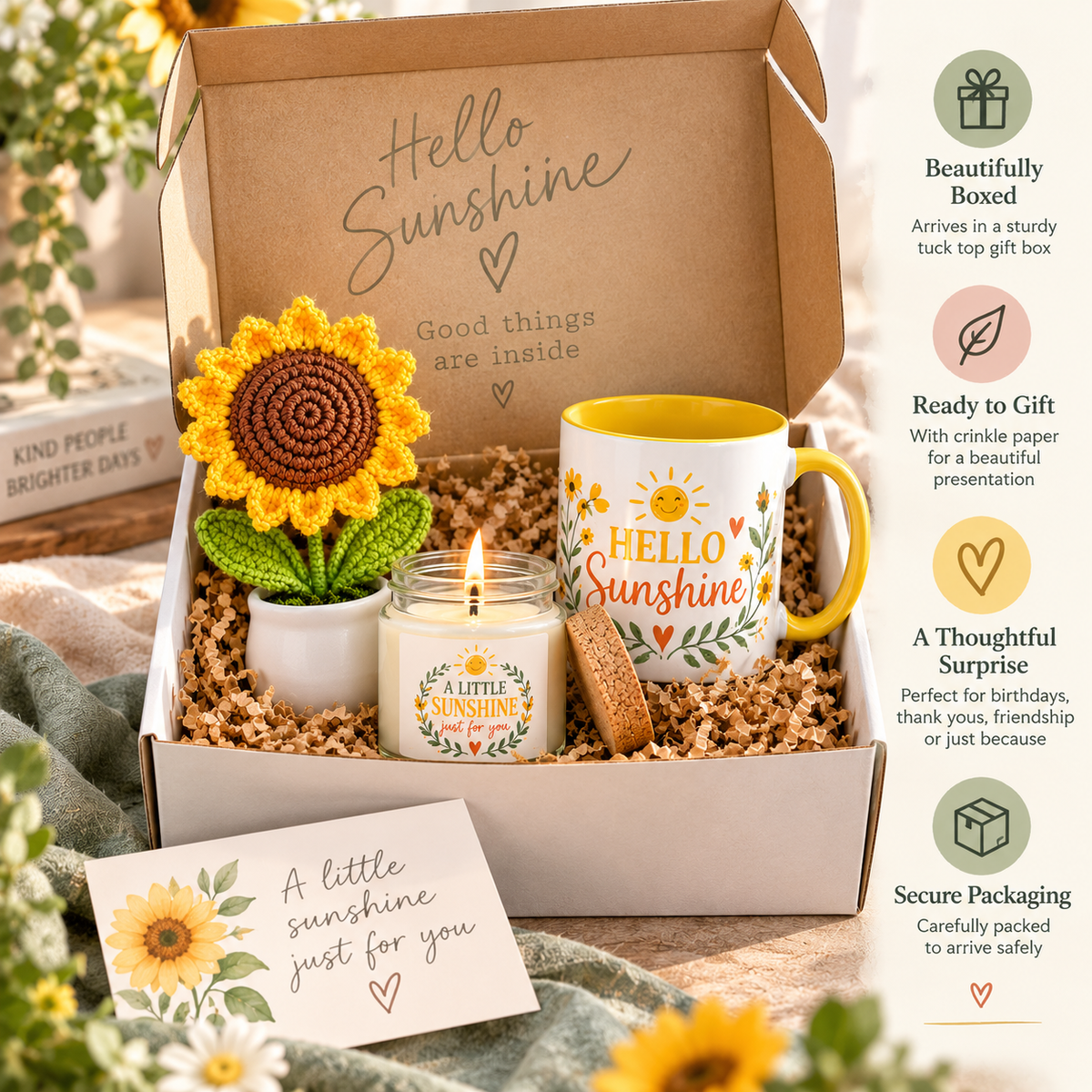 A curated gift box set labeled 'Hello Sunshine' arranged in a kraft gift box with a crocheted sunflower, a small candle, a yellow-and-white mug, and a card, shown in a styled setting with decorative flowers and a vertical feature callout on the right.