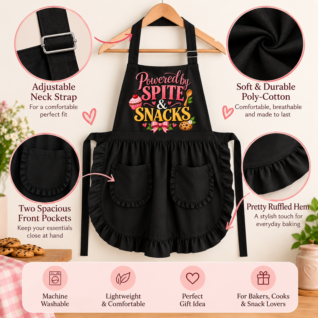 Black apron with a colorful 'Powered by SPITE SNACKS' graphic, shown hanging on a wooden hanger with circular detail callouts highlighting its features.