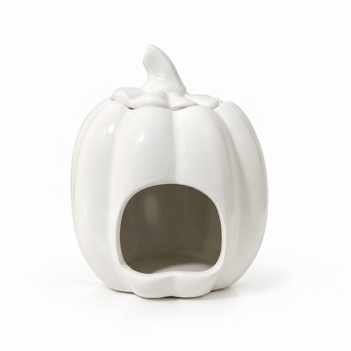 A white ceramic pumpkin-shaped dog house with a small stem on top and a round opening in the front, photographed on a clean white background.