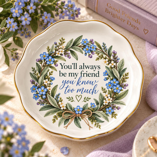 Ceramic friendship trinket dish with blue forget-me-not wreath, gold rim and funny best friend message.