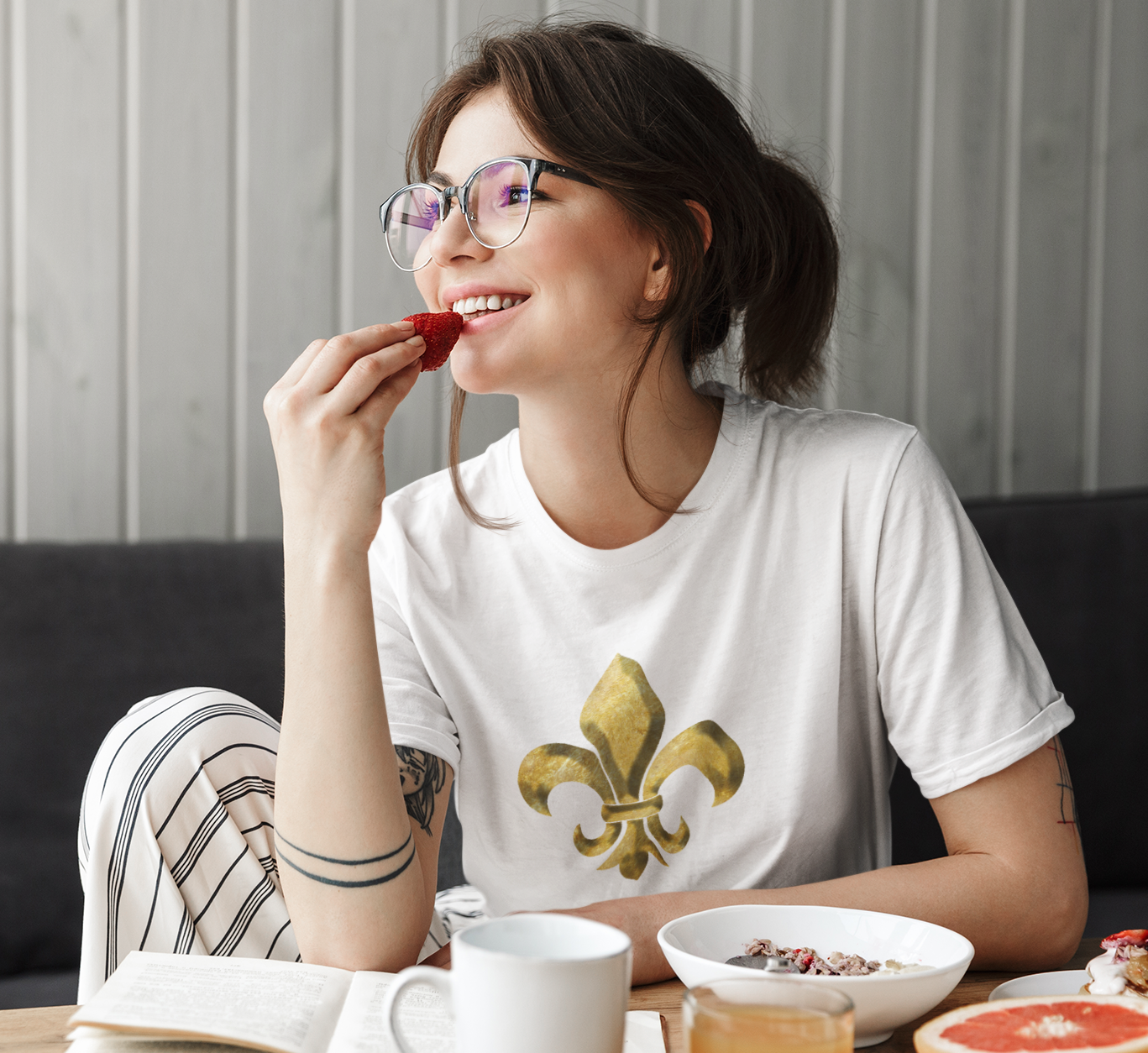 young brunette woman in glasses wearing a white tshirt 
