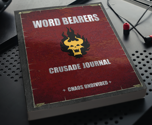 Word Bearers Crusade Journal Lying on top of a desk lying nearby a pair of headphones 